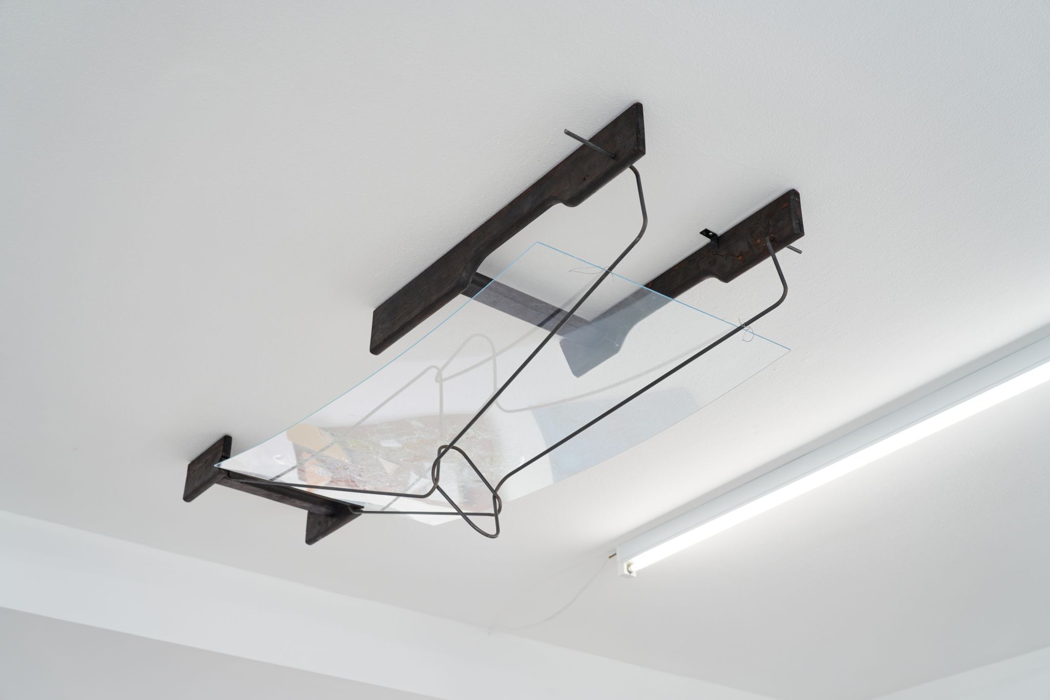 Tomaso De Luca, Hochmaus, 2023, Burned wood, acrylic glass, resin, glass, steel, 40 ⁠× ⁠52 ⁠× ⁠140 ⁠⁠cm