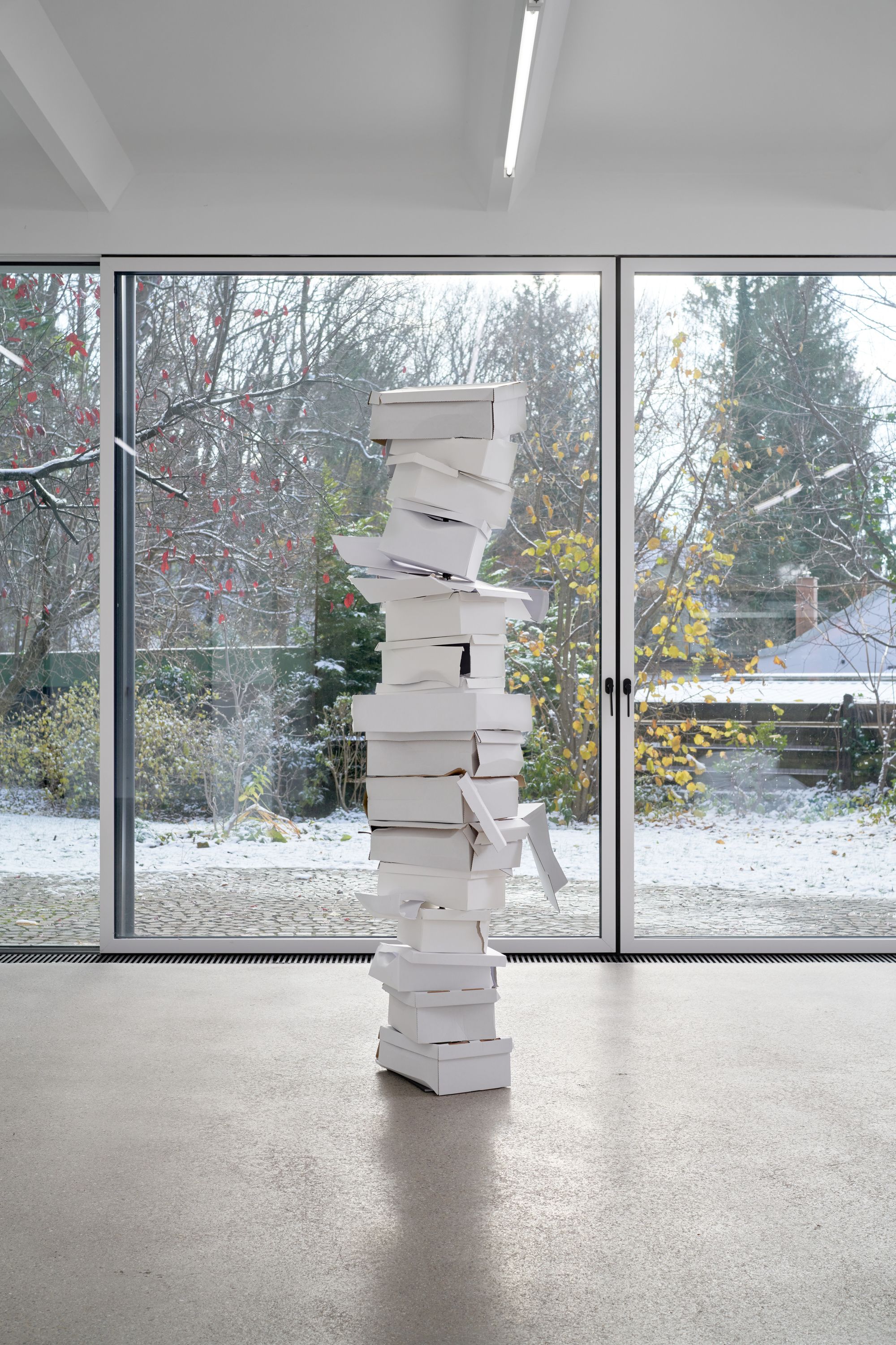 Davide Stucchi, Still pending #1, 2023, Various cardboard boxes, metal bar, 187 ⁠× ⁠55 ⁠× ⁠60 ⁠⁠cm